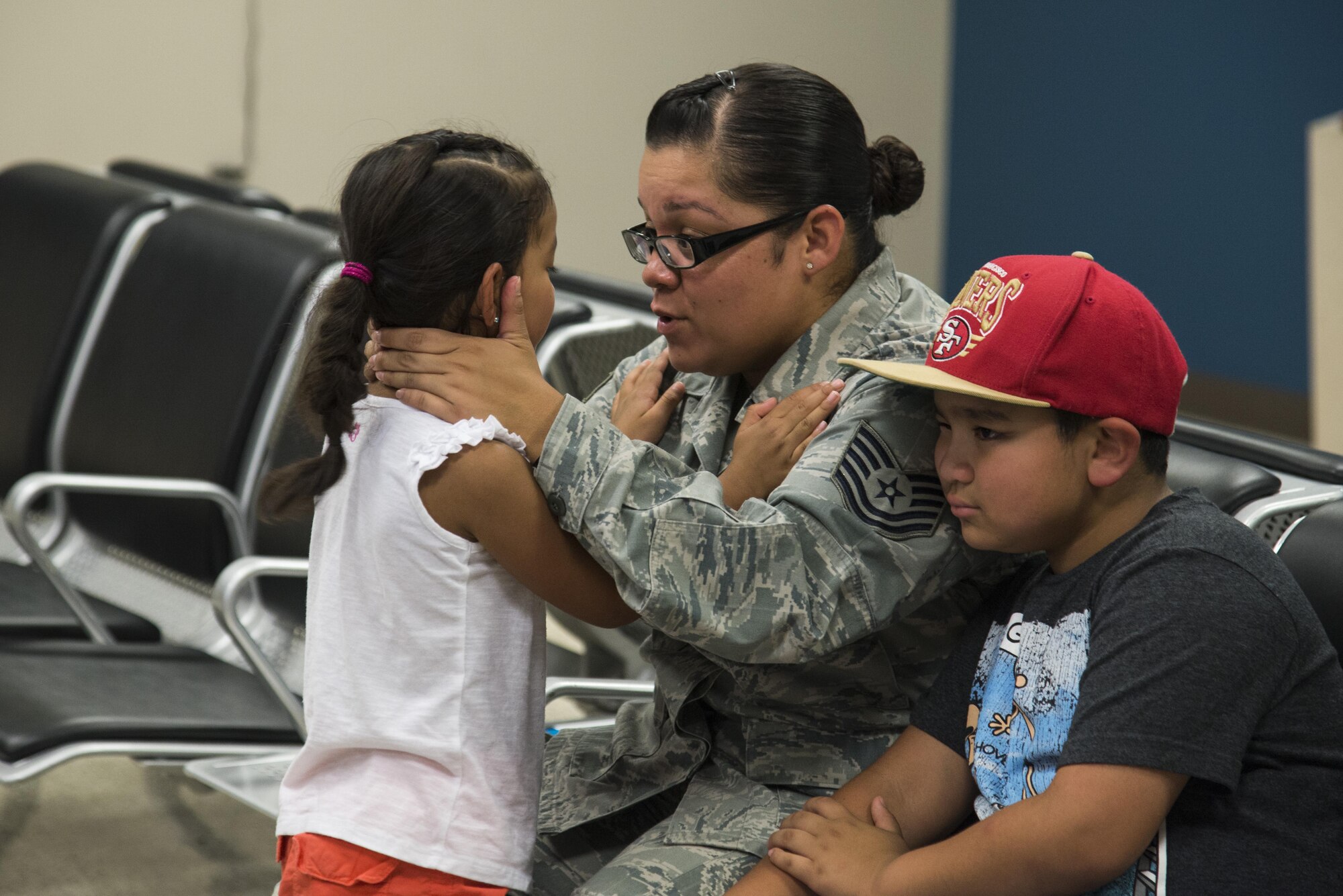 Tech. Sgt. Maria Bilbo, 437th Supply Chain Operations Squadron, says goodbye to her children before deploying from Scott Air Force Base.  
