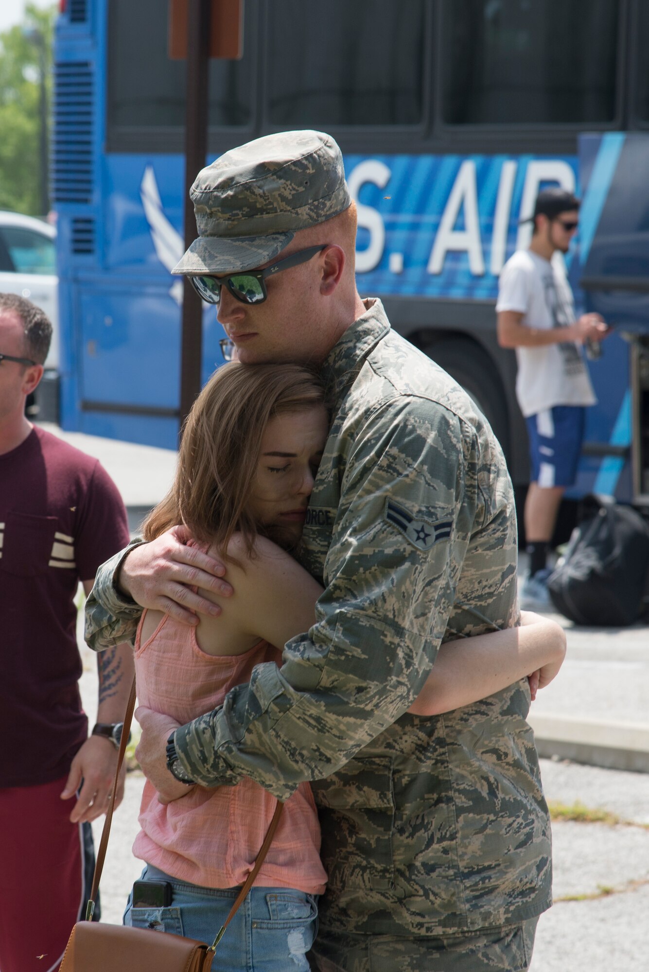 A Team Scott member hugs a loved one goodbye before deploying from Scott Air Force Base. 