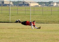 Cristopher Sage, Air Force Global Strike Command softball team centerfielder, lays out for a catch in the bottom of the second inning at Barksdale Air Force Base, La., July 21, 2016. Sage scored three runs in the game and hit a homerun in the third inning. (U.S. Air Force photo/Airman 1st Class Stuart Bright)