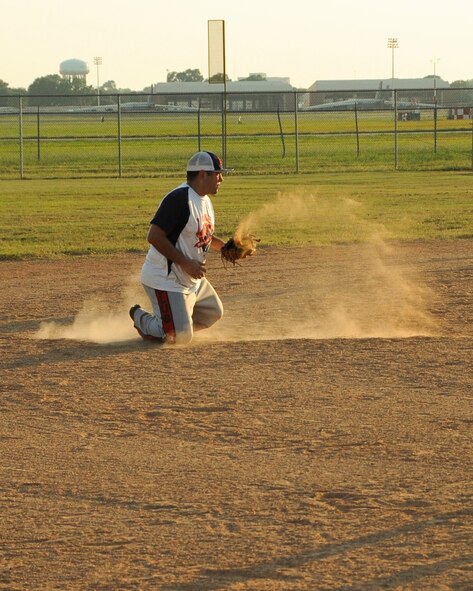 Guillermo Herrera, Air Force Global Strike Command softball team shortstop, snags a line drive in the bottom of the sixth inning at Barksdale Air Force Base, La., July 21, 2016. The defensive play wasn’t enough to stop the 2nd Maintenance Squadron softball team from scoring three more runs that inning. (U.S. Air Force photo/Airman 1st Class Stuart Bright)