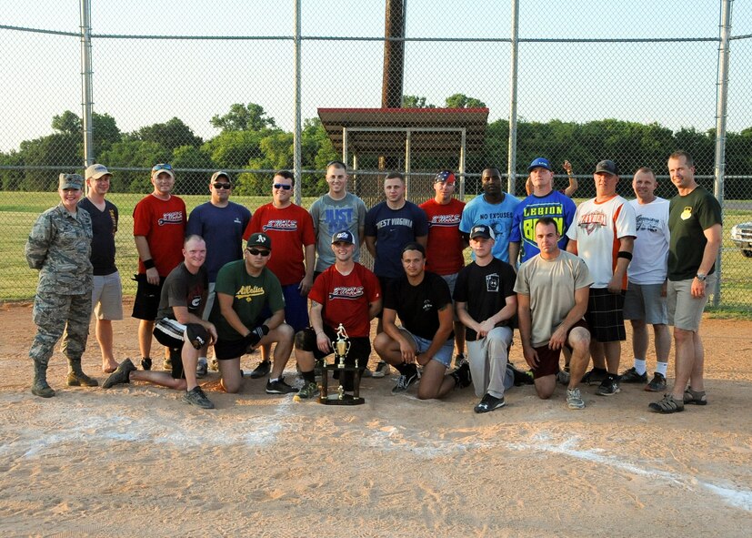 The 2nd Maintenance Squadron softball team poses with Col. Ty Neuman, 2nd Bomb Wing commander, after winning the Intramural Softball Championship 13-9 at Barksdale Air Force Base, La., July 21, 2016. After losing in the title game the previous two years, 2nd MXS finally prevailed and beat the Air Force Global Strike Command softball team. (U.S. Air Force photo/Airman 1st Class Stuart Bright)