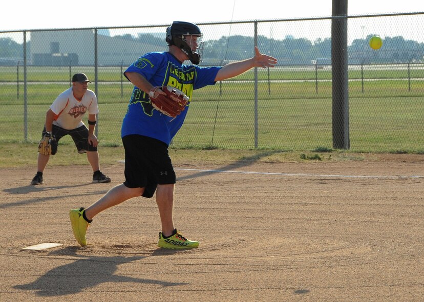 Matt Lachney, 2nd Maintenance Squadron softball team pitcher, tosses the first pitch of the intramural softball championship game at Barksdale Air Force Base, La., July 21, 2016. Lachney pitched all seven innings in his team’s 13-9 victory over the Air Force Global Strike Command softball team. (U.S. Air Force photo/Airman 1st Class Stuart Bright)