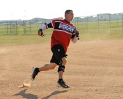 Cristopher Sage, Air Force Global Strike Command softball team centerfielder, runs to third in the top of the first inning at Barksdale Air Force Base, La., July 21, 2016. Sage would score the second of two runs in that inning for AFGSC. (U.S. Air Force photo/Airman 1st Class Stuart Bright)