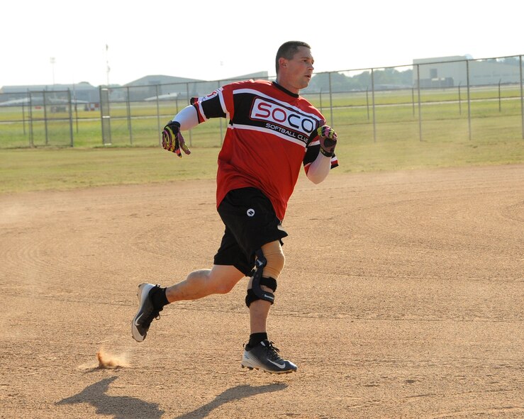 Cristopher Sage, Air Force Global Strike Command softball team centerfielder, runs to third in the top of the first inning at Barksdale Air Force Base, La., July 21, 2016. Sage would score the second of two runs in that inning for AFGSC. (U.S. Air Force photo/Airman 1st Class Stuart Bright)
