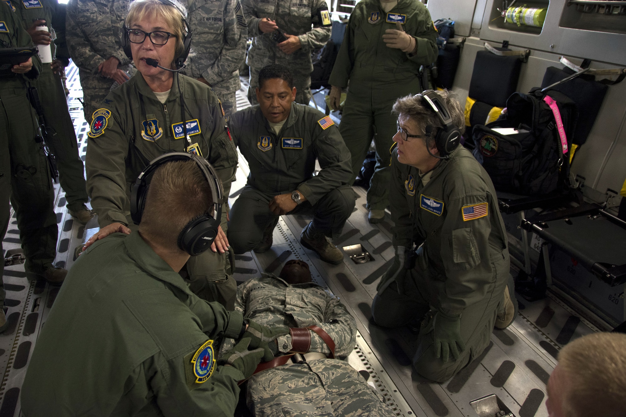 Col. Jeanne LaFountain, 349th Aeromedical Evacuation Squadron commander, instructs Airmen how to properly detain an aggressive passenger aboard a C-17 Globemaster III, during Exercise Patriot Wyvern, July 23,2016.
The 349th Aeromedical Staging Squadron, 349th Medical Squadron and the 349th Aeromedical Evacuation Squadron practiced in-flight emergency and evacuation processes during the training event at Travis Air Force base, Calif.
Patriot Wyvern is a hands-on, bi-annual event conducted by the 349th AMW, and designed to hone combat skills and improve organizational interoperability. (U.S. Air Force photo by Senior Airman Sajjan Singh)