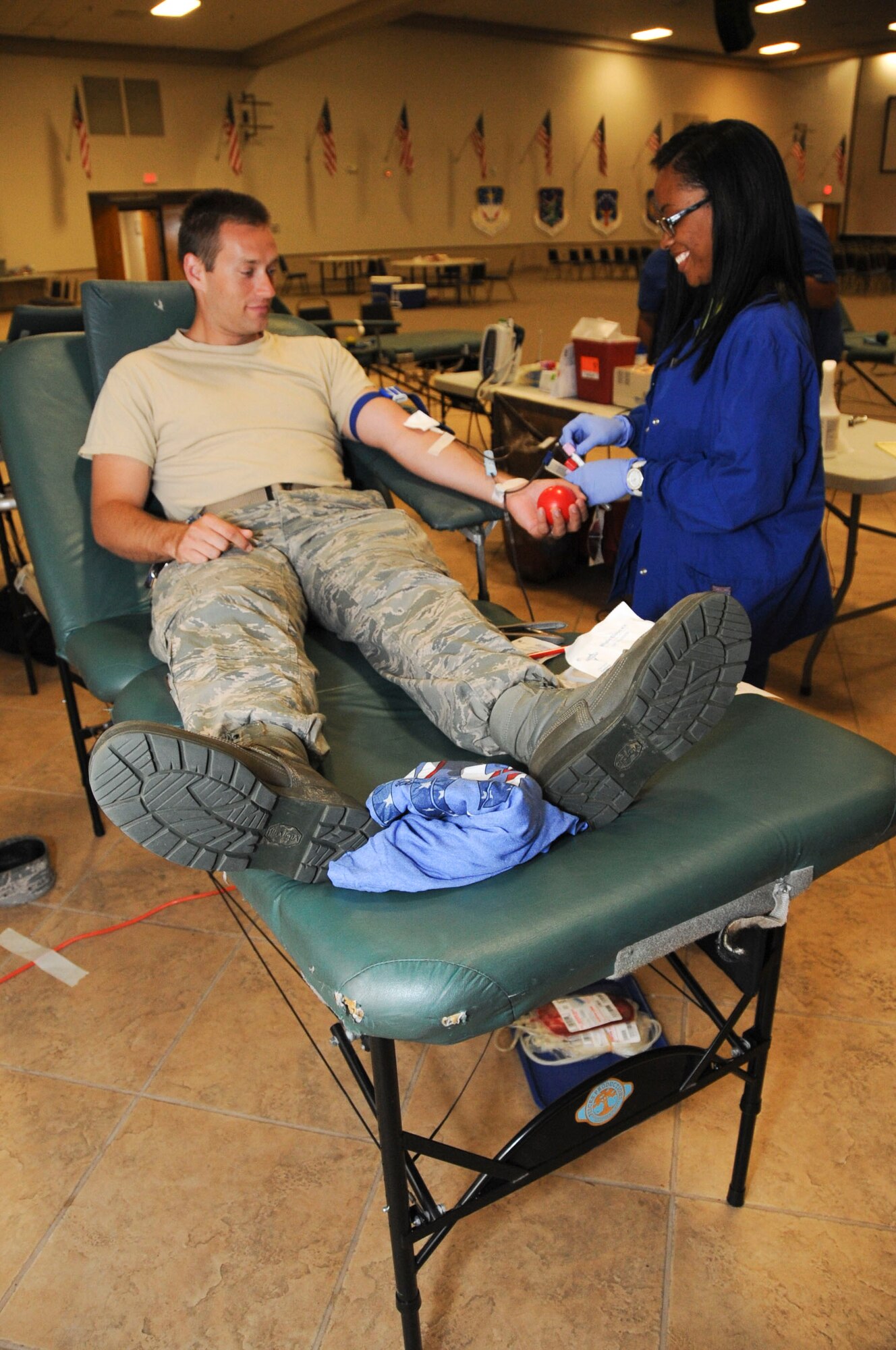 Staff Sgt. Brandon Allen, 2nd Aircraft Maintenance Squadron supply liaison, donates blood during the Life Share blood drive and marrow registry at Barksdale Air Force Base, La., July 25, 2016. Individuals who donate whole blood, which includes red cells and plasma, are able to donate one unit every 56 days. Those who donate only red cells, which results in two units of blood, may donate again after 112 days. (U.S. Air Force photo/Airman Alexis C. Frost)