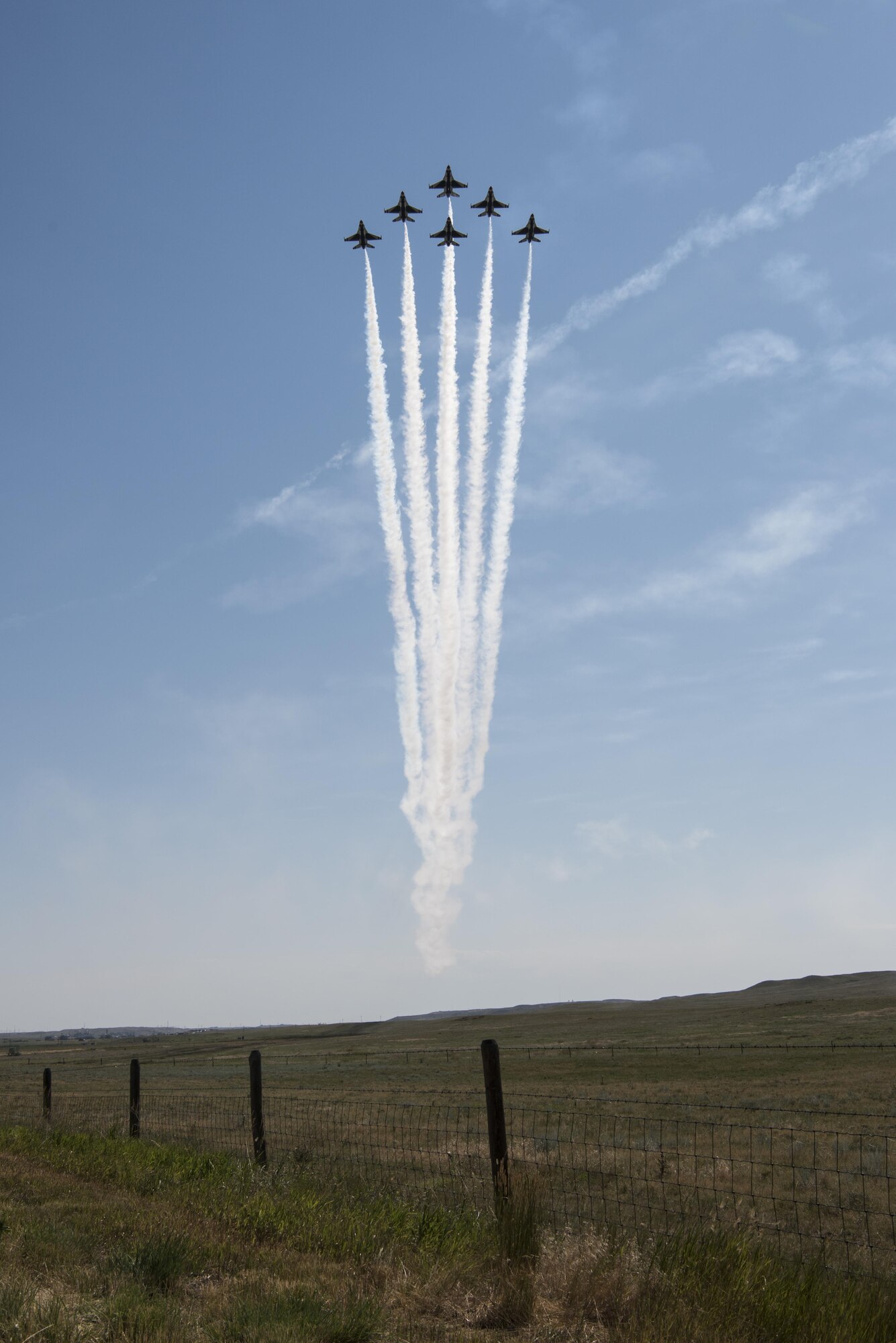 The U.S. Air Force Thunderbirds fly in a delta formation during Cheyenne Frontier Days, July 27, 2016, in Cheyenne, Wyo. A Thunderbirds performance displays the pride, precision and professionalism of the team while highlighting the skills and training indicative of all members of the U.S. Air Force. (U.S. Air Force photo by Staff Sgt. Christopher Ruano)
