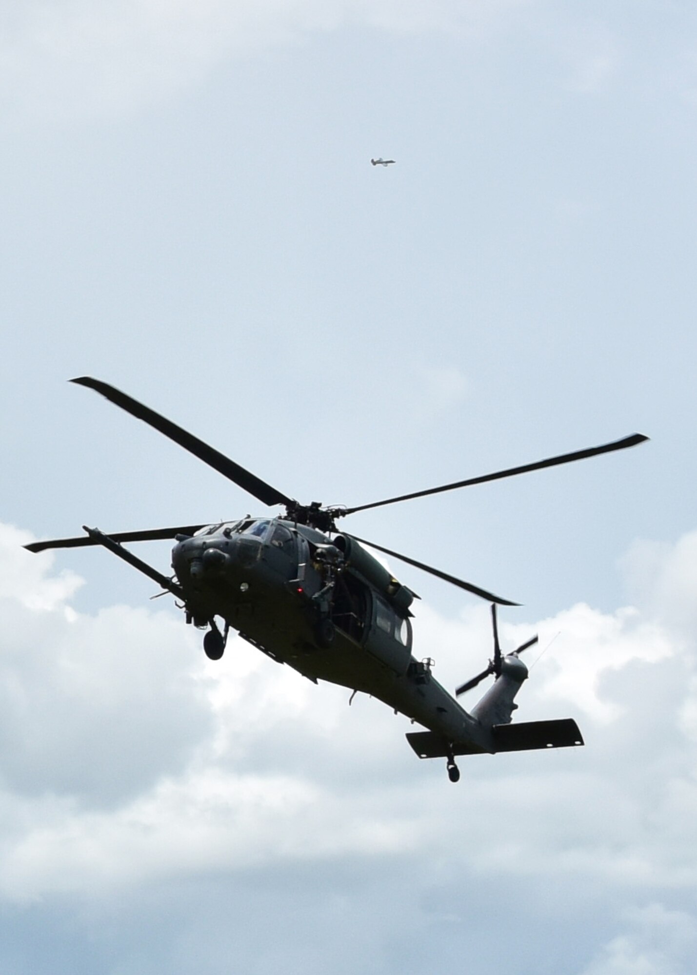 An HH-60G Pave Hawk helicopter and A-10C Thunderbolt II aircraft work together July 21 during a training exercise focused on tactics the A-10C can offer during combat operations, providing close air support for the combat search and rescue squadron. Approximately 200 Airmen from the 924th conducted their annual tour at Patrick Air Force Base, allowing the unit from Arizona to gain experience and train with the 920th Rescue Wing.   (U.S. Air Force photo by Tech. Sgt. Louis Vega Jr.)