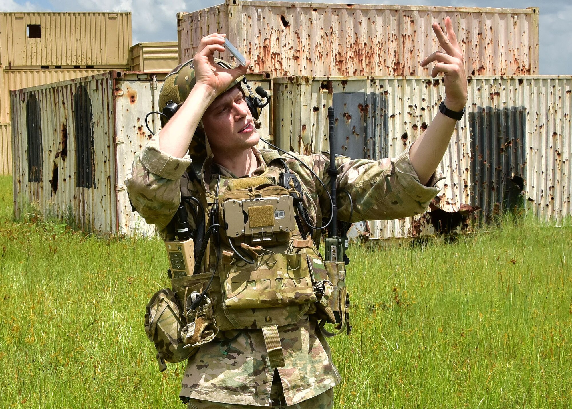 Staff Sgt. John Brantley, 165th Air Support Operations Squadron joint terminal attack controller, uses a mirror to help A-10C Thunderbolt II pilots from the 924th Fighter Group, pin point his location during training at Avon Park Air Force Range, Fla. The training focused on tactics the A-10C can offer during combat operations, providing close air support for the combat search and rescue squadron. Approximately 200 Airmen from the 924th conducted their annual tour at Patrick Air Force Base, allowing the unit from Arizona to gain experience and train with the 920th Rescue Wing. (U.S. Air Force photo by Tech. Sgt. Louis Vega Jr.)