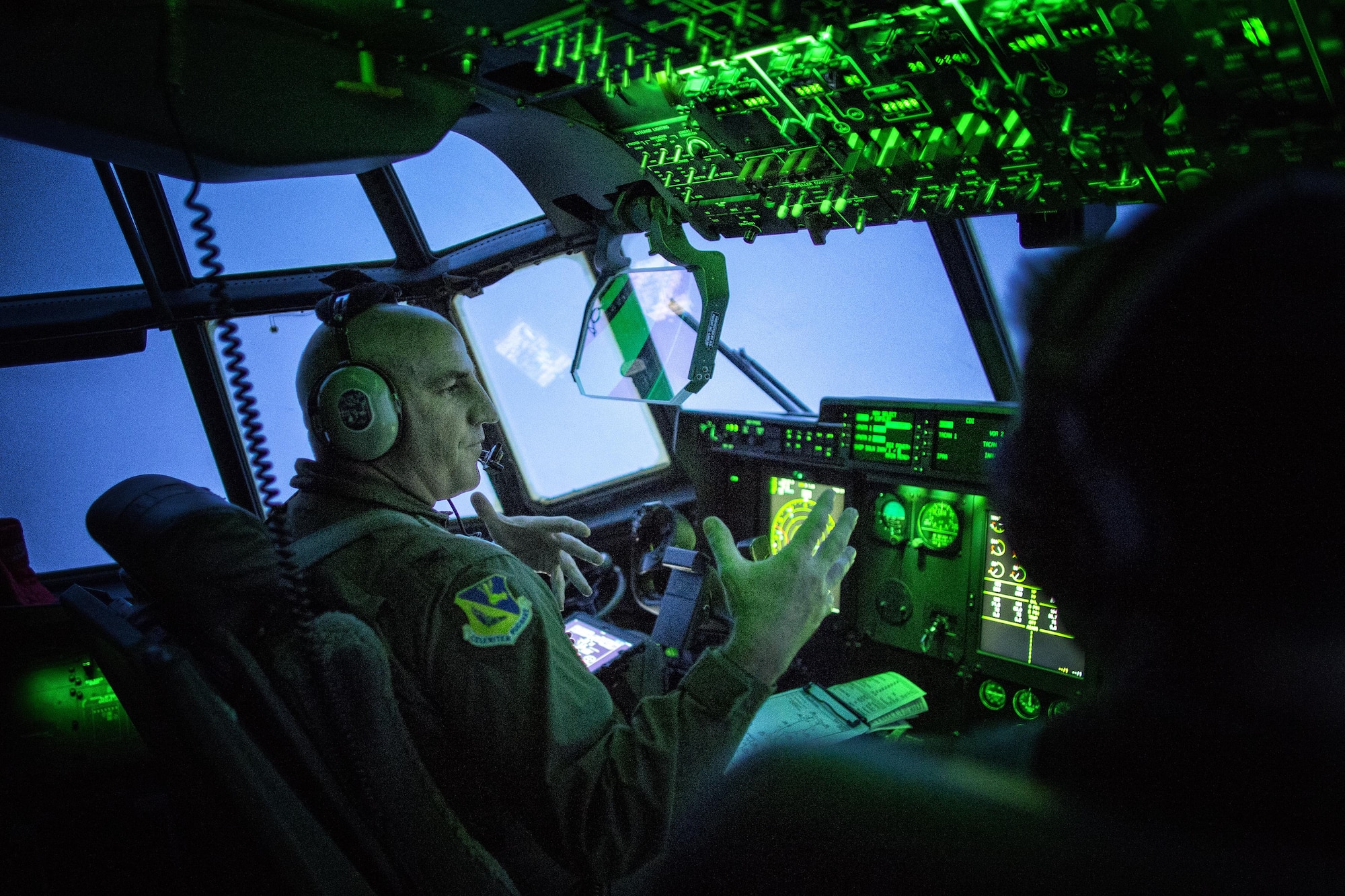 Col. Kenneth Moss, 374th Airlift Wing commander, flies over the Kanto Planes during a training mission. Three C-130J Super Hercules from Dyess Air Force Base, Texas, traveled to Yokota to aid in transition from C-130Hs to C-130Js. Fourteen C-130Js are scheduled to start replacing Yokota’s C-130Hs later this year, which have been in service since 1974. (U.S. Air Force photo by Yasuo Osakabe/Released) 