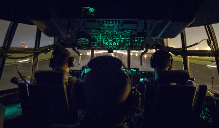 Capt. David Jacobs, 39th Airlift Squadron pilot, Col. Kennth Moss, 374th Airlift Wing commander, Capt. Michael McKenna, 39 AS pilot, approch for a landing during a training flight at Yokota Air Base, Japan, July 21, 2016. Three C-130Js from Dyess Air Force Base, Texas, traveled to Yokota to aid in transition from C-130Hs to C-130Js. Fourteen C-130Js are scheduled to start replacing Yokota’s C-130Hs later this year, which have been in service since 1974. (U.S. Air Force photo by Yasuo Osakabe/Released) 