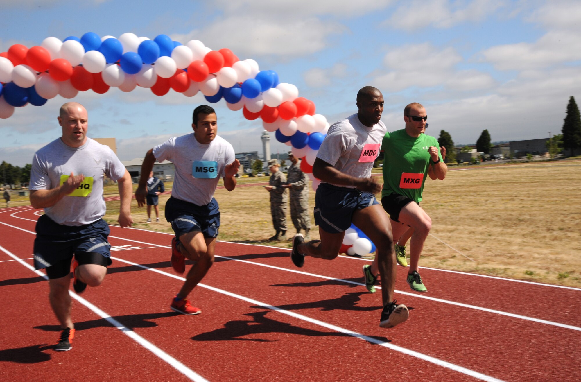 Airmen from the 142nd Fighter Wing fight for position from the start at the new track at the Portland Air National Guard Base, Ore., July 26, 2016, during an inaugural first race. From left to right are Staff Sgt. Andrew Hensley, Senior Airman Christopher Alesko, Staff Sgt. Breland Reed, Staff Sgt. Alan Plank and Tech. Sgt. Justin Comfort. (U.S. Air National Guard photo by Tech. Sgt. John Hughel, 142nd Fighter Wing Public Affairs/Released)