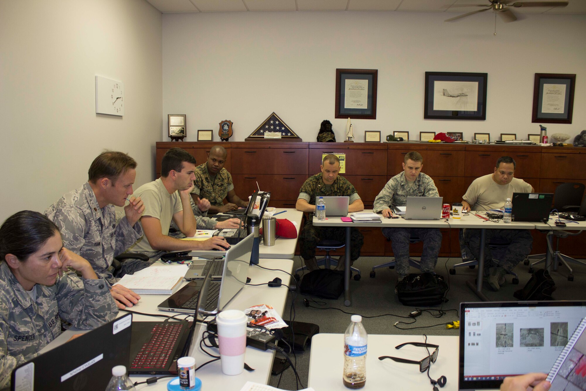 Joint Force contingency airfield pavement evaluation students analyze data and prepare a contingency airfield pavement evaluation report during the field training portion of their course at the Air Force Civil Engineer Center at Tyndall Air Force Base, Florida. (U.S. Air Force Photo/Susan Lawson)