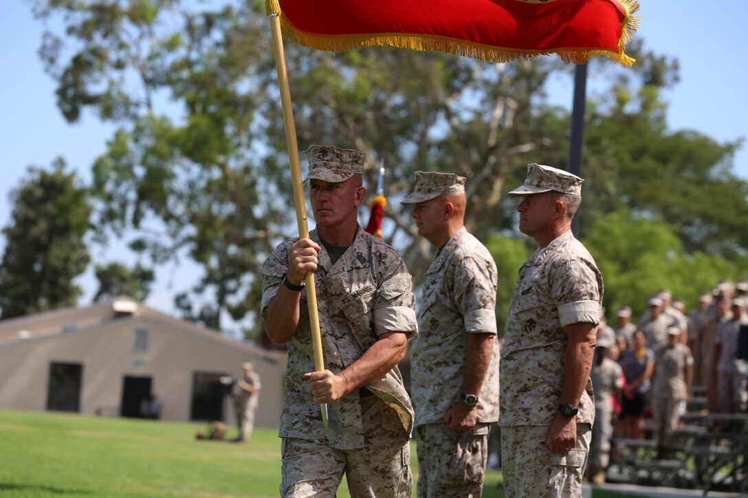 Sgt. Maj. Bradley Kasal, the sergeant major of I Marine Expeditionary Force, marches with the colors during a change of command ceremony at Camp Pendleton July 27, 2016. During the ceremony, Berger relinquished his duties as the commanding general of I MEF to Craparotta. (U.S. Marine Corps photo by Cpl. Garrett White/ RELEASED)