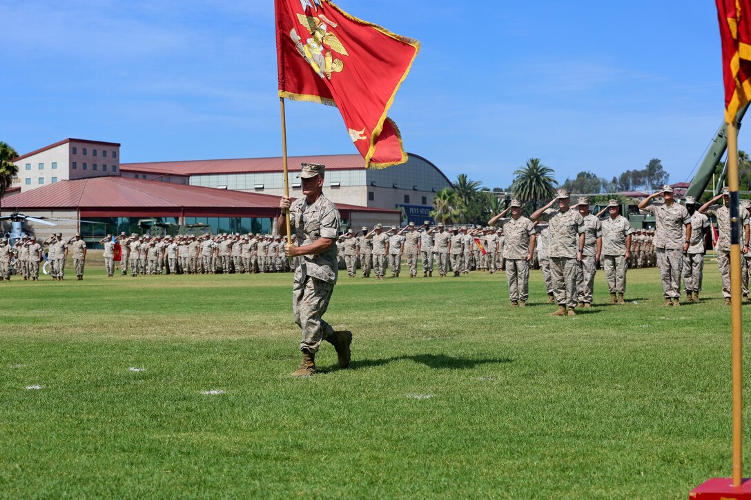 Sgt. Maj. Bradley Kasal, the sergeant major of I Marine Expeditionary Force, marches with the colors during a change of command ceremony at Camp Pendleton July 27, 2016. During the ceremony, Lt. Gen. David H. Berger relinquished his duties as the commanding general of I MEF to Lt. Gen. Lewis Craparotta. (U.S. Marine Corps photo by Cpl. Demetrius Morgan/ RELEASED)