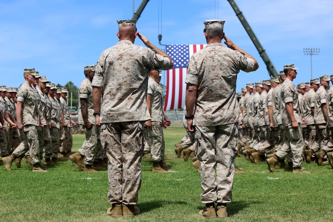 Lt. Gen. Lewis A. Craparotta, (right), the commanding general of I Marine Expeditionary Force, and Lt. Gen. David H. Berger, (left), the outgoing commanding general of I MEF, salute during the pass and review of I MEF Marines during a change of command ceremony at Camp Pendleton July 27, 2016.  During the ceremony, Berger relinquished his duties as the commanding general of I MEF to Craparotta. (U.S. Marine Corps photo by Cpl. Demetrius Morgan/ RELEASED)
