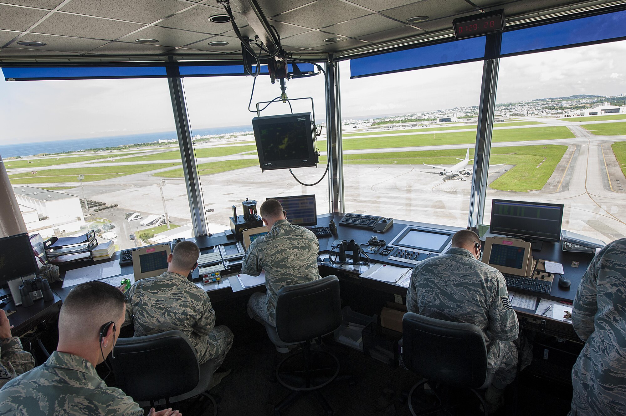 Air traffic controllers from the 18th Operations Support Squadron monitor the flightline for safety risks July 21, 2016, at Kadena Air Base, Japan. Kadena is the largest combat wing in the Pacific. Safety during flightline operations is of the utmost importance for Kadena’s air traffic controllers.  (U.S. Air Force photo by Airman 1st Class Lynette M. Rolen)