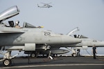 Two F/A-18E Super Hornets undergo preliminary checks on the flight deck of the aircraft carrier USS Dwight D. Eisenhower in the Arabian Gulf, July 26, 2016. The USS Eisenhower and its Carrier Strike Group are deployed in support of Operation Inherent Resolve, maritime security operations and theater security cooperation efforts in the U.S. 5th Fleet area of operations. Navy photo by Petty Officer 3rd Class Theodore Quintana 