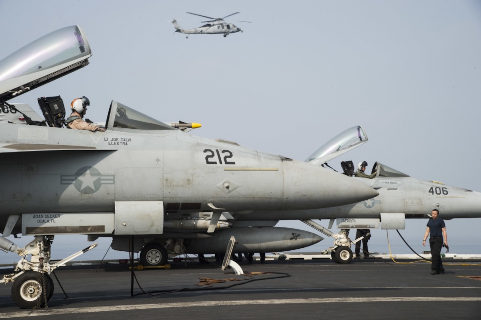 Two F/A-18E Super Hornets undergo preliminary checks on the flight deck of the aircraft carrier USS Dwight D. Eisenhower in the Arabian Gulf, July 26, 2016. The USS Eisenhower and its Carrier Strike Group are deployed in support of Operation Inherent Resolve, maritime security operations and theater security cooperation efforts in the U.S. 5th Fleet area of operations. Navy photo by Petty Officer 3rd Class Theodore Quintana 