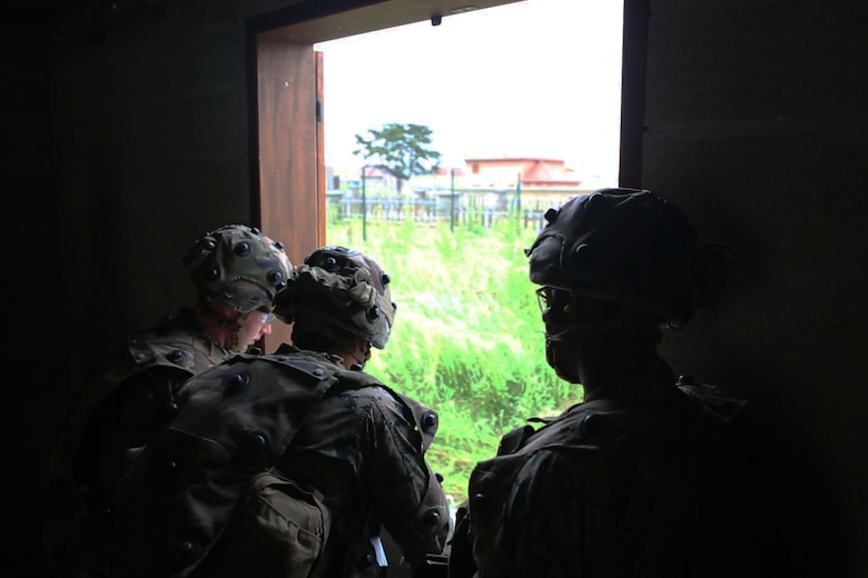 U.S. Marines with Bravo company, 1st Battalion, 8th Marine Regiment, Special Purpose Marine Air-Ground Task Force-Crisis Response-Africa search for a simulated enemy during a Non-combatant evacuation operation exercise hosted by French Army Center for Urban Combat Training instructors aboard Camp Sissonne, France, June 21, 2016. SPMAGTF-CR-AF Marines trained alongside a company of French Army soldiers, integrating their skills and resources to form an effective battle plan, similar to what they may face in the event of a future crisis. (U.S. Marine Corps photo by Sgt. Kassie L. McDole/Released)