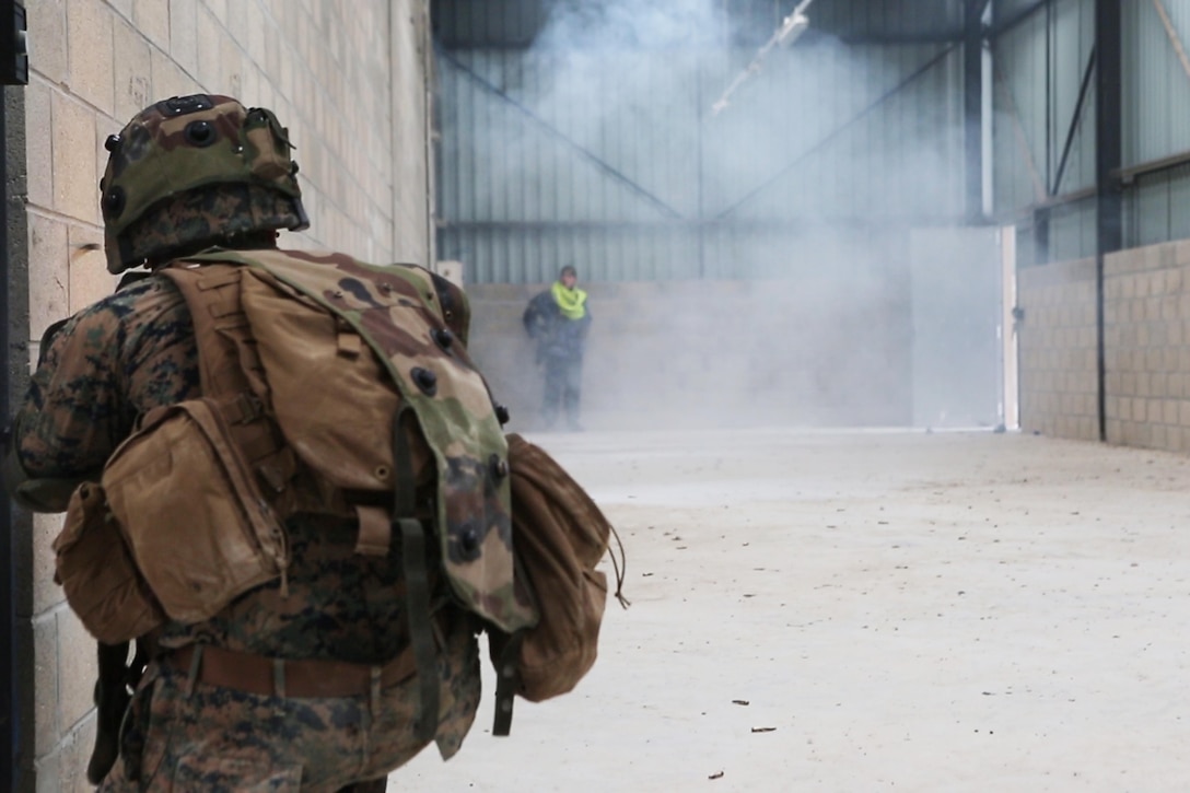 U.S. Marine Corps Lance Cpl. William T. Wallace, a team leader with Bravo company, 1st Battalion, 8th Marine Regiment, Special Purpose Marine Air-Ground Task Force-Crisis Response-Africa fires his French FAMAS F1 at a simulated enemy during a Non-combatant evacuation operation exercise hosted by French Army Center for Urban Combat Training instructors aboard Camp Sissonne, France, June 21, 2016. SPMAGTF-CR-AF Marines trained alongside a company of French Army soldiers, integrating their skills and resources to form an effective battle plan, similar to what they may face in the event of a future crisis. (U.S. Marine Corps photo by Sgt. Kassie L. McDole/Released) 