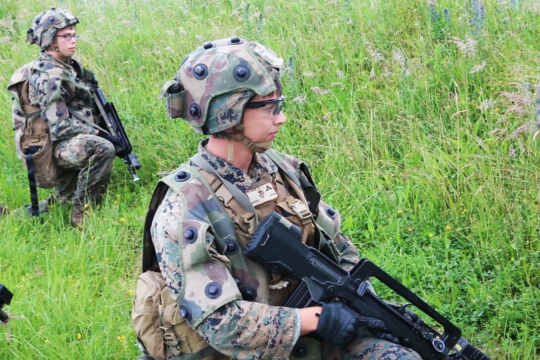 U.S. Marine Corps Lance Cpl. Harley F. Whitmeyer, (left), and Lance Cpl. Alexander R. Welniak, (right), both rifleman with Bravo company, 1st Battalion, 8th Marine Regiment, Special Purpose Marine Air-Ground Task Force-Crisis Response-Africa post security during a Non-combatant evacuation operation exercise hosted by French Army Center for Urban Combat Training instructors aboard Camp Sissonne, France, June 21, 2016. SPMAGTF-CR-AF Marines trained alongside a company of French Army soldiers, integrating their skills and resources to form an effective battle plan, similar to what they may face in the event of a future crisis. (U.S. Marine Corps photo by Sgt. Kassie L. McDole/Released) 