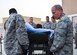 Lt. Col. Chris Hull (right), flight commander of the 379th Enroute Patient Staging Facility, leads his medical team during the loading of a stretchered patient onto an ambulance for evacuation July 18, 2016 from Al Udeid Air Base, Qatar.  The team moved 14 patients, including a military working dog, onto a C-17 Globemaster III flight to U.S. military facilities in Germany. (U.S. Air Force photo/Technical Sgt. Carlos J. Treviño)