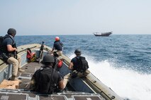 160627-N-VS214-404 ARABIAN GULF (June 27, 2016) The visit, board, search and seizure team from the dock landing ship USS Harpers Ferry (LSD 49) approaches a dhow for a welfare check on the crew. Harpers Ferry is part of the Boxer Amphibious Ready Group and, with the embarked 13th Marine Expeditionary Unit, is deployed in support of maritime security operations and theater security cooperation efforts in the U.S. 5th Fleet area of operations. (U.S. Navy photo by Mass Communication Specialist 3rd Class Zachary Eshleman/Released)   