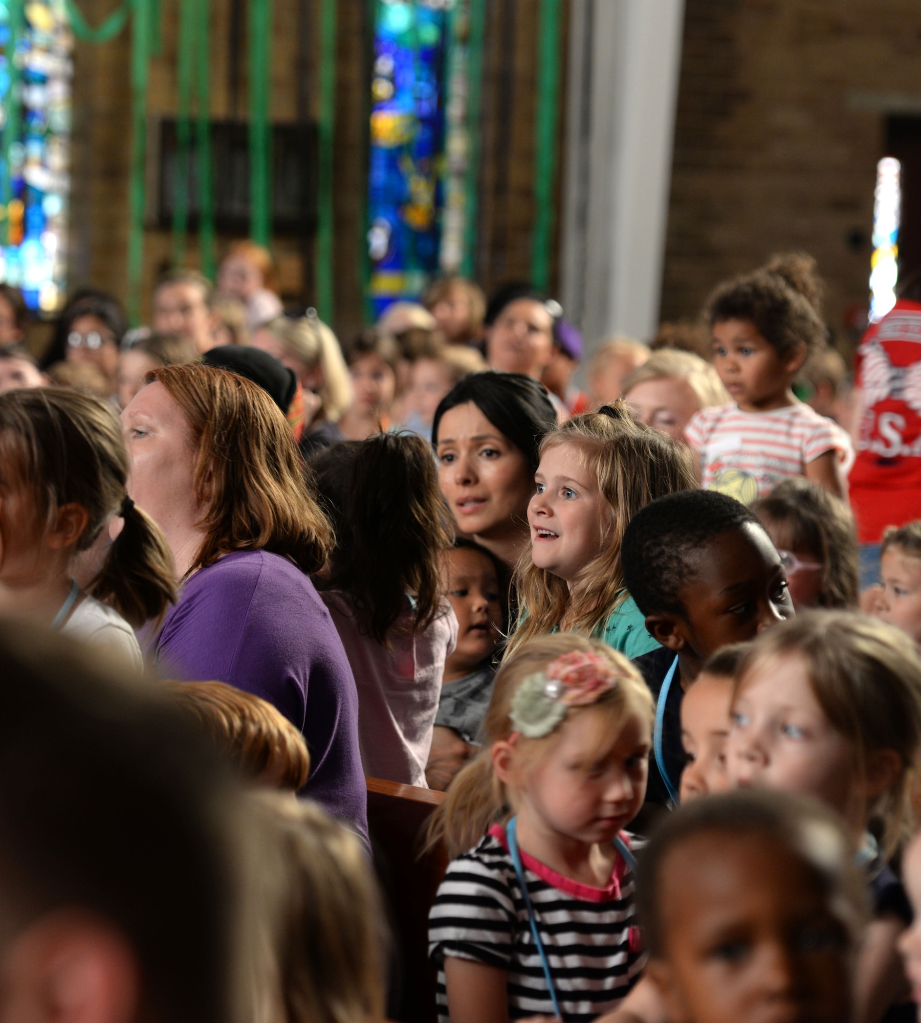 Team Mildenhall children and parents take part in Vacation Bible School July 25, 2016, in the chapel on RAF Mildenhall, England. The chapel hosts this event annually to bring families together. (U.S. Air Force photo by Gina Randall)