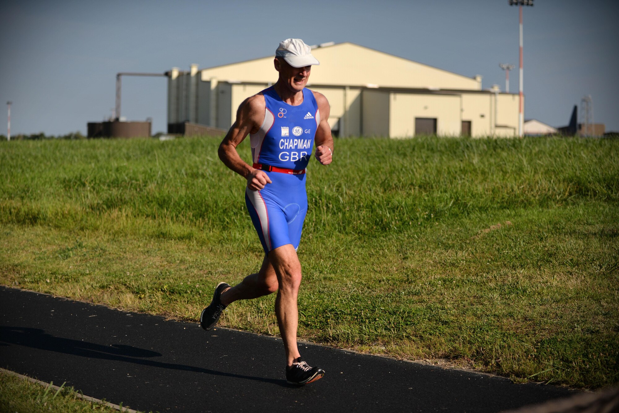 A participant of the 3rd Annual Duathlon runs July 23, 2016, on RAF Mildenhall, England. The duathlon started with a two-mile run, followed by cycling 20 miles around the base perimeter, and finished with another two-mile run. (U.S. Air Force photo by Senior Airman Christine Halan)