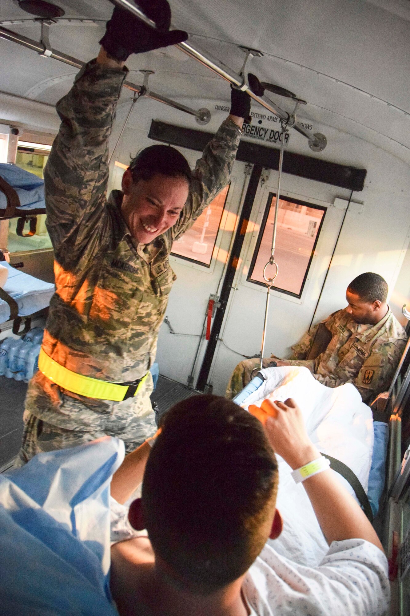 Staff Sgt. Jennifer McKendry, 379th Expeditionary Medical Group Enroute Patient Staging Facility medical technician, supports a patient during transport July 18, 2016, at Al Udeid Air Base, Qatar.  The patient was one of 14 military members flown on a C-17 Globemaster III to Landstuhl Regional Medical Center, Germany, to receive a higher level of care than what is routinely available at deployed locations. (U.S. Air Force photo/Technical Sgt. Carlos J. Treviño)