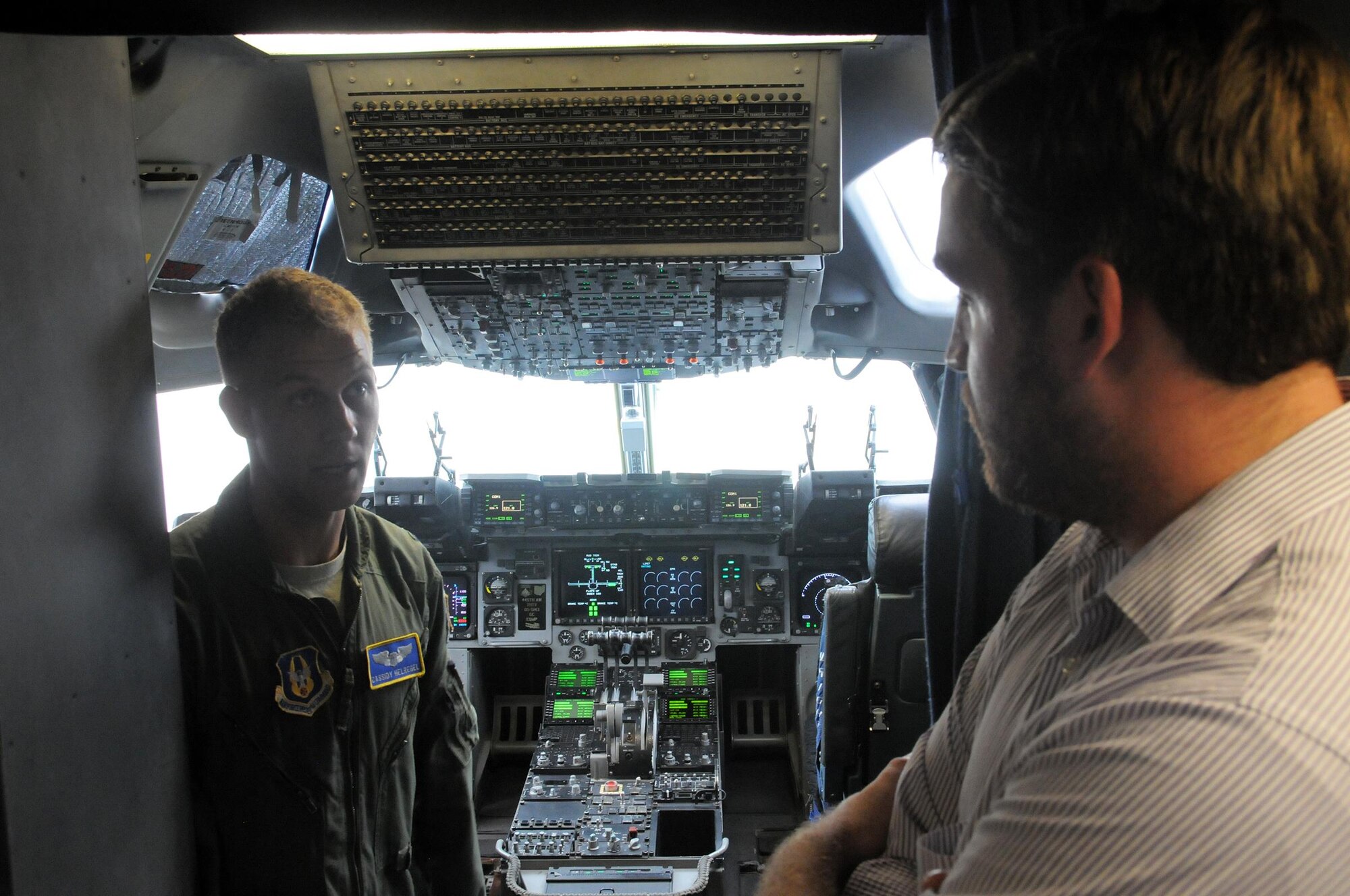 Capt. Cassidy Helregel, 89th Airlift Squadron C-17 pilot, shows Mr. Geoff Daniels, Southwest Ohio Regional Representative for Senator Sherrod Brown, the flightdeck of a C-17 Globemaster III during his visit to the 445th Airlift Wing July 26, 2016. Mr. Daniels also visited with Airmen from the 445th Aeromedical Evacuation Squadron also onboard the aircraft and learned about their role in the Air Force Reserve. Before stepping out to the aircraft, Mr. Davis received a wing mission briefing and visited with 445th Airmen. (U.S. Air Force photo/Tech. Sgt. Anthony Springer)