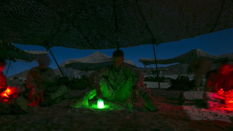 2nd Lt. Zachary Standeford, platoon commander, 3rd Battalion, 4th Marine Regiment, reviews the performance of his squad in the nighttime live-fire exercises as part of Tactical Small-Unit Leadership Course at Marine Corps Air Ground Combat Center, Twentynine Palms, California, July 18, 2016. The purpose of the course was to focus on the training of small-unit leadership within “Darkside.”