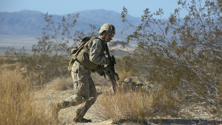 Cpl. Shane Martin, team leader, 3rd Battalion, 4th Marine Regiment, advances during a fire team live-fire exercise as part of Tactical Small-Unit Leadership Course at Marine Corps Air Ground Combat Center, California, July 18, 2016. The purpose of the course was to focus on the training of small-unit leadership within “Darkside.”