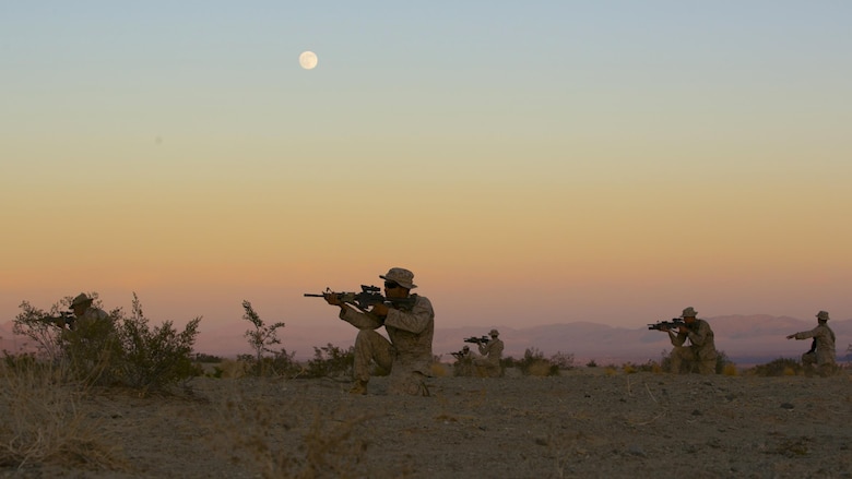 A squad of Marines with 3rd Battalion, 4th Marine Regiment, practice dry runs before their night time live-fire exercises as part of Tactical Small-Unit Leadership Course at Marine Corps Air Ground Combat Center, Twentynine Palms, California, July 18, 2016. The purpose of the course was to focus on the training of small-unit leadership within “Darkside.”