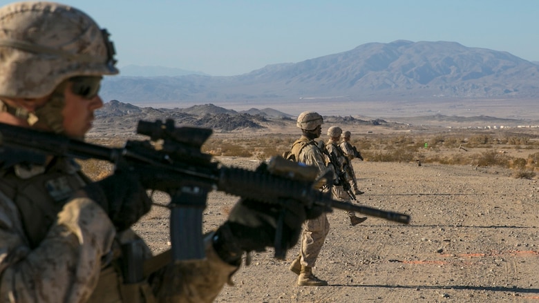 Marines with 3rd Battalion, 4th Marine Regiment, proceed in a skirmisher formation at the beginning of a live-fire exercise as part of Tactical Small-Unit Leadership Course at Marine Corps Air Ground Combat Center, Twentynine Palms, California, July 18, 2016. The purpose of the course was to focus on the training of small-unit leadership within “Darkside.”