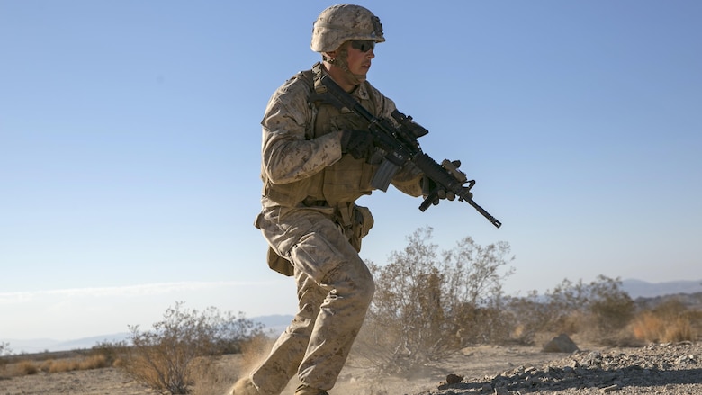 Cpl. Reid Ohala, team leader, 3rd Battalion, 4th Marine Regiment, advances during a live-fire exercise as part of Tactical Small-Unit Leadership Course at Marine Corps Air Ground Combat Center, Twentynine Palms, California, July 18, 2016. The purpose of the course was to focus on the training of small-unit leadership within “Darkside.”