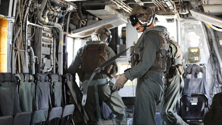 Marines with Marine Heavy Helicopter Squadron 461 prepare to assist Marines with U.S. Marine Corps Forces Special Operations Command during a fast rope and rappelling training exercise on Landing Zone Parrot at Marine Corps Base Camp Lejeune, N.C., July 20, 2016. The exercise was a part of a two weeklong Helicopter Insertion and Extraction Techniques Course. The CH-53 provided for the training evolution was assigned to Marine Heavy Helicopter Squadron 461, 2nd Marine Aircraft Wing.