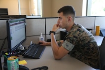 Cpl. Vyacheslav Rakhminov, an administrative specialist with Headquarters and Headquarters Squadron, works at the new installation personnel administration center on Marine Corps Air Station New River July 20. Before moving into the new building on July 18th, IPAC was worked in two separate buildings. The new 17,000 square foot building serves as a centralized location for Marines stationed at the air station. (U.S. Marine Corps photo by Cpl. Mark Watola /Released)