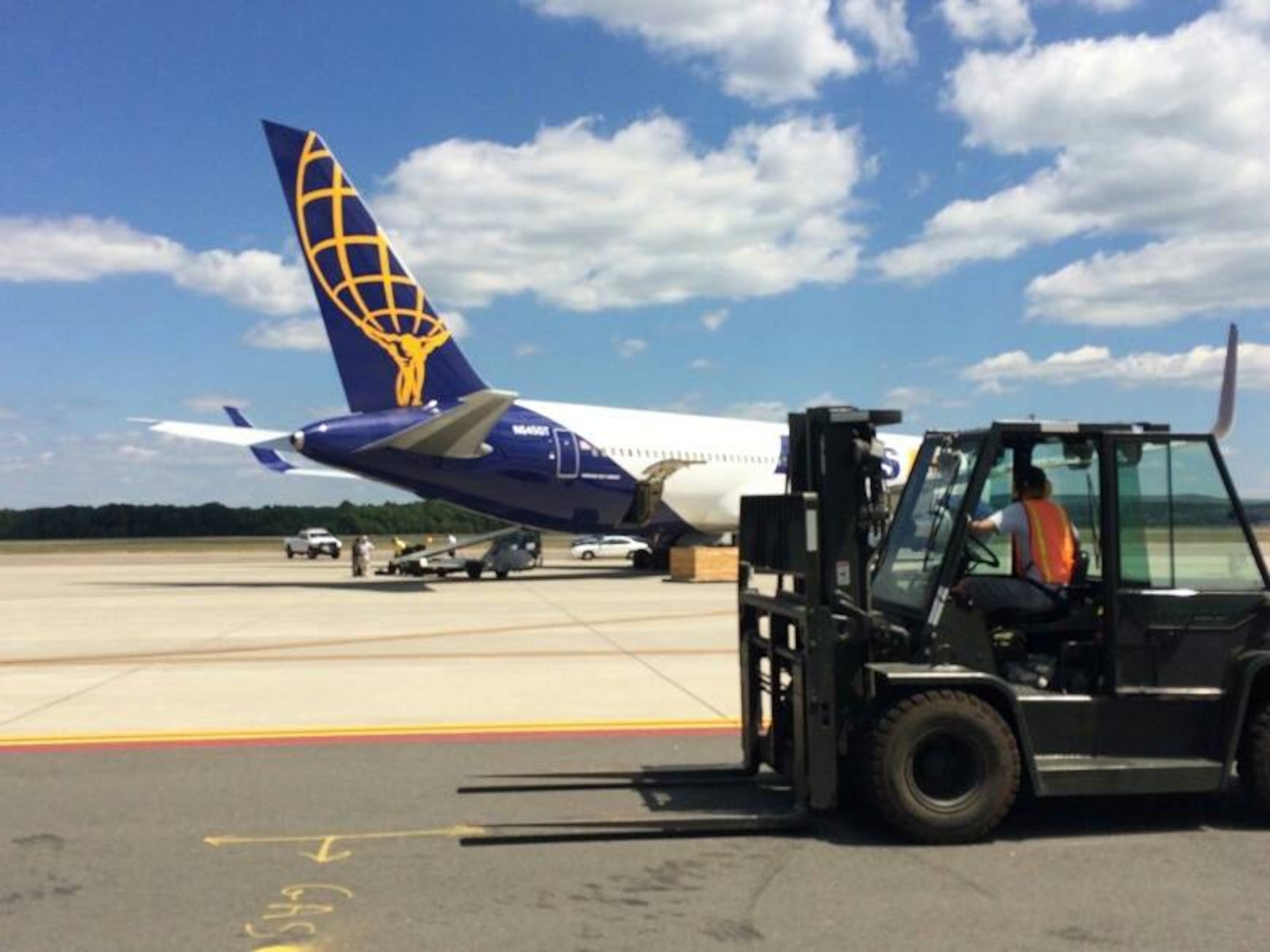 Dozens of troops from Westover Air Reserve Base head for Southwest Asia on a contract "rotator". The single-point pickup on base saved tens of thousands of dollars and allowed families to send off their loved ones.