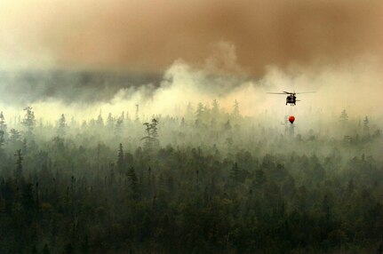 The Michigan Army National Guard helps put out a fire about six miles north of Newberry in Luce County and about 10 miles from Tahquamenon Falls State Park in the Upper Pennisula of Michigan. 