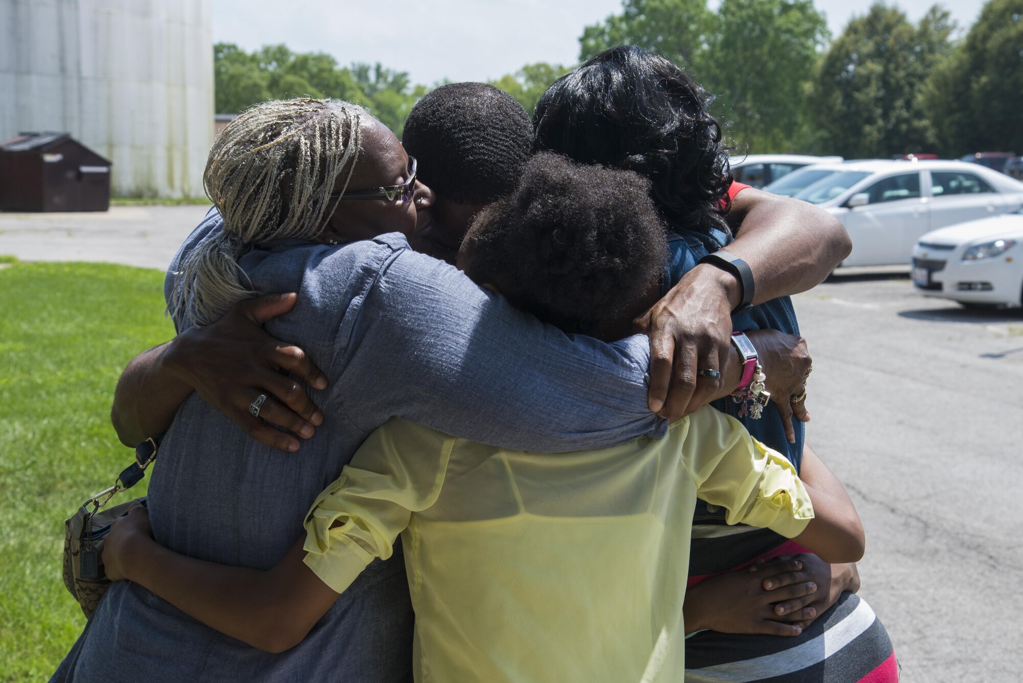 A team Scott member gives his last goodbyes to his family before deploying from Scott Air Force Base, Illinois. (U.S. Air Force photo by Airman 1st Class Gwendalyn Smith)
