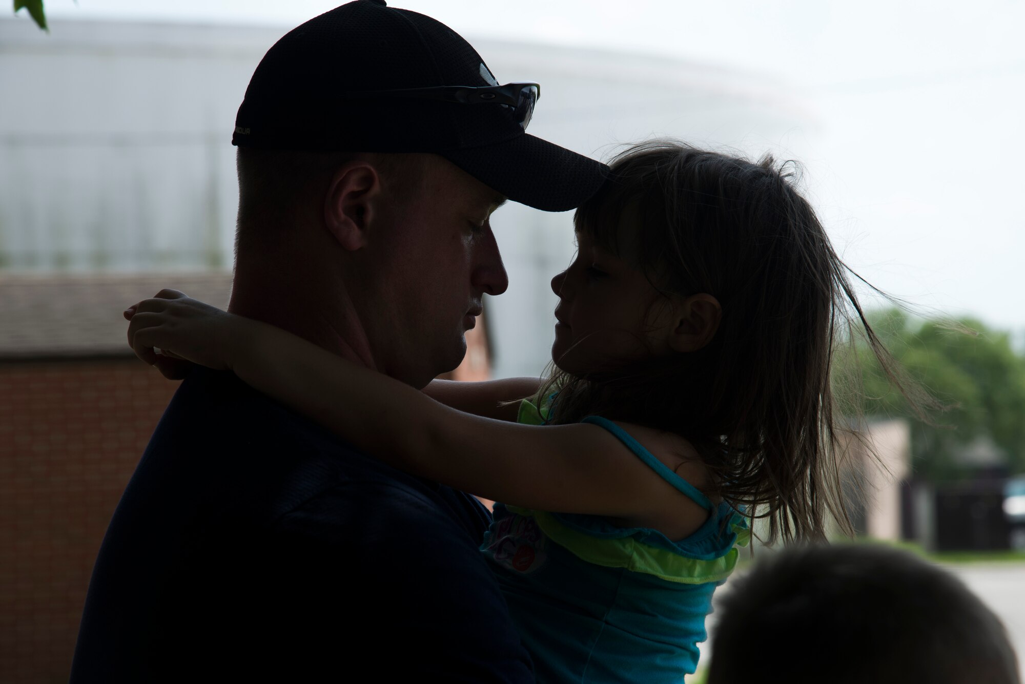 Staff Sgt. Corey Tharp, 375th Civil Engineering Fire Crew Chief, says goodbye to his daughter before deploying from Scott Air Force Base, Illinois. (U.S. Air Force photo by Airman 1st Class Gwendalyn Smith)