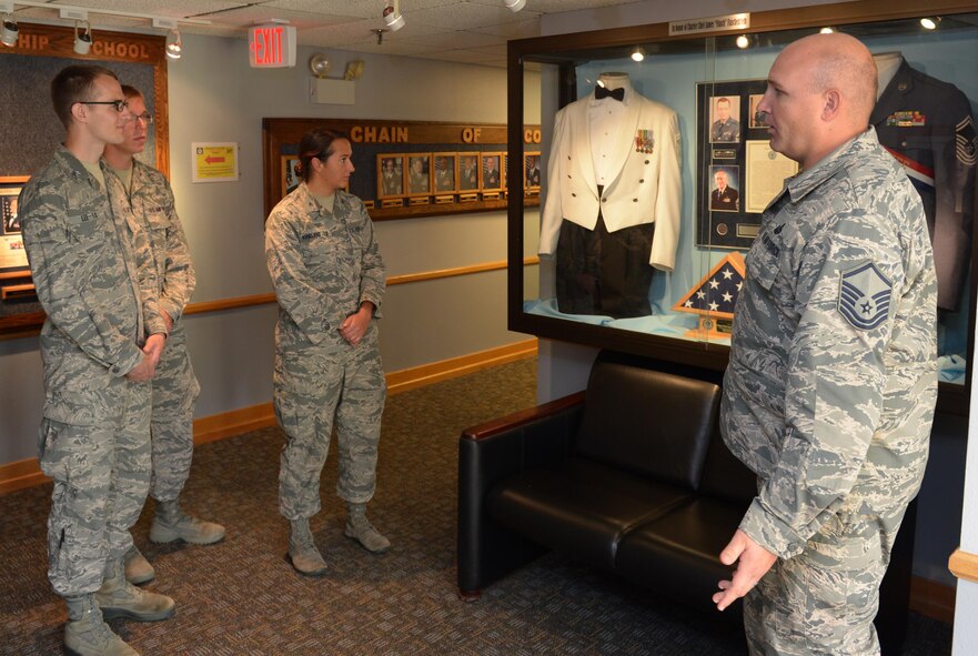 Master Sgt. Jeremy Woods, Airman Leadership School commandant, speaks about the Air Force rank structure to United States Air Force Academy cadets during an immersion tour at Barksdale Air Force Base, La., July 12, 2016. After completion of two years of education at the academy, cadets are sent to bases across the world to experience the operational Air Force firsthand and aid in deciding whether they will continue their Air Force training and also help prioritize their career field options. (U.S. Air Force photo/Senior Airman Curt Beach)