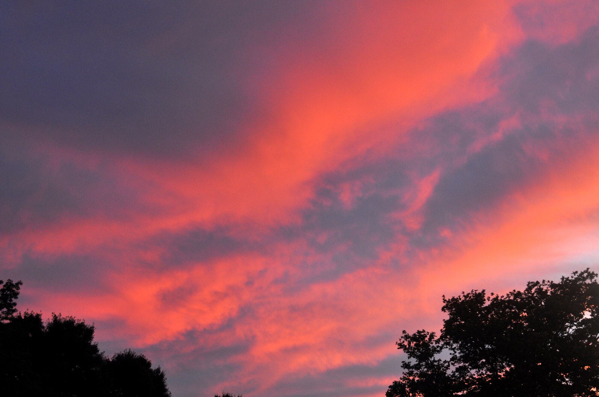 The sunrise taken outside of the 514th Air Mobility Wing building at Joint Base McGuire-Dix-Lakehurst, New Jersey. The brilliant colors alter familiar surroundings. Try looking at things in a different light. (U.S. Air Force photo/Lt. Col. Kimberly M. Lalley)