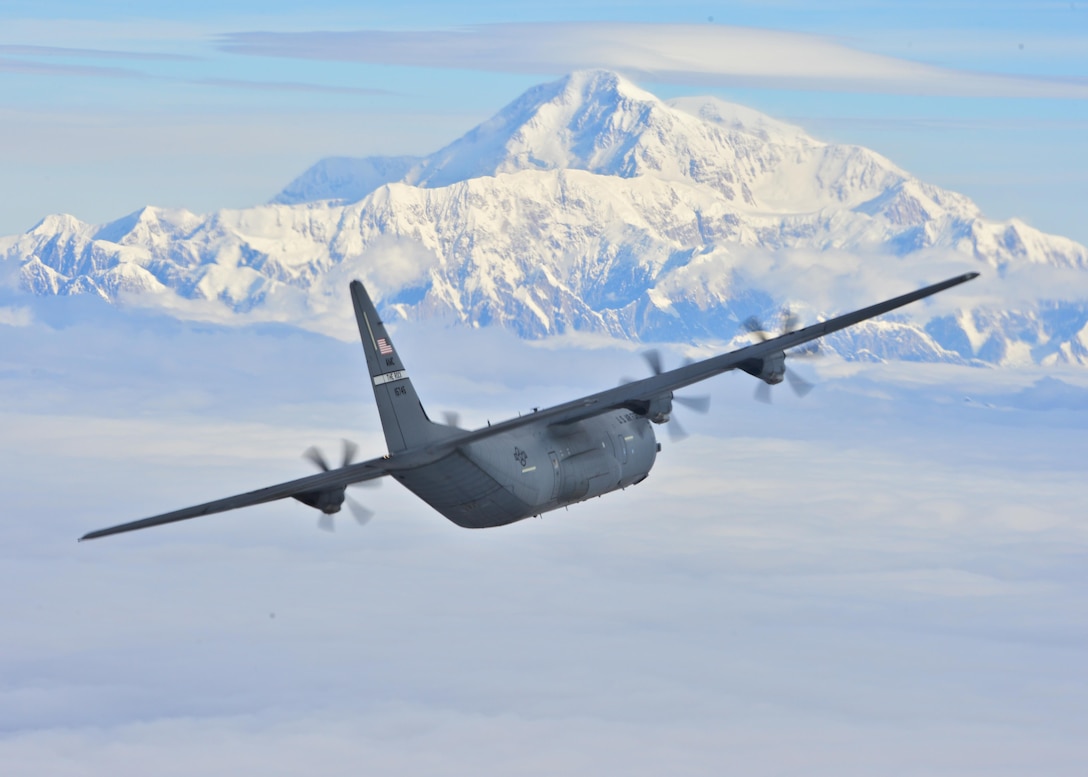 A C-130J Super Hercules from the 41st Airlift Squadron flies past Denali, the highest peak in North America, July 19, 2016. The 41st AS conducted training in Alaska to prepare for the terrain present in austere locations. Alaska provides an uncontended airspace, which allows aircrews to train more effectively without having to adjust to commercial flight patterns. (U.S. Air Force photo/Senior Airman Kaylee Clark)                                                                                      