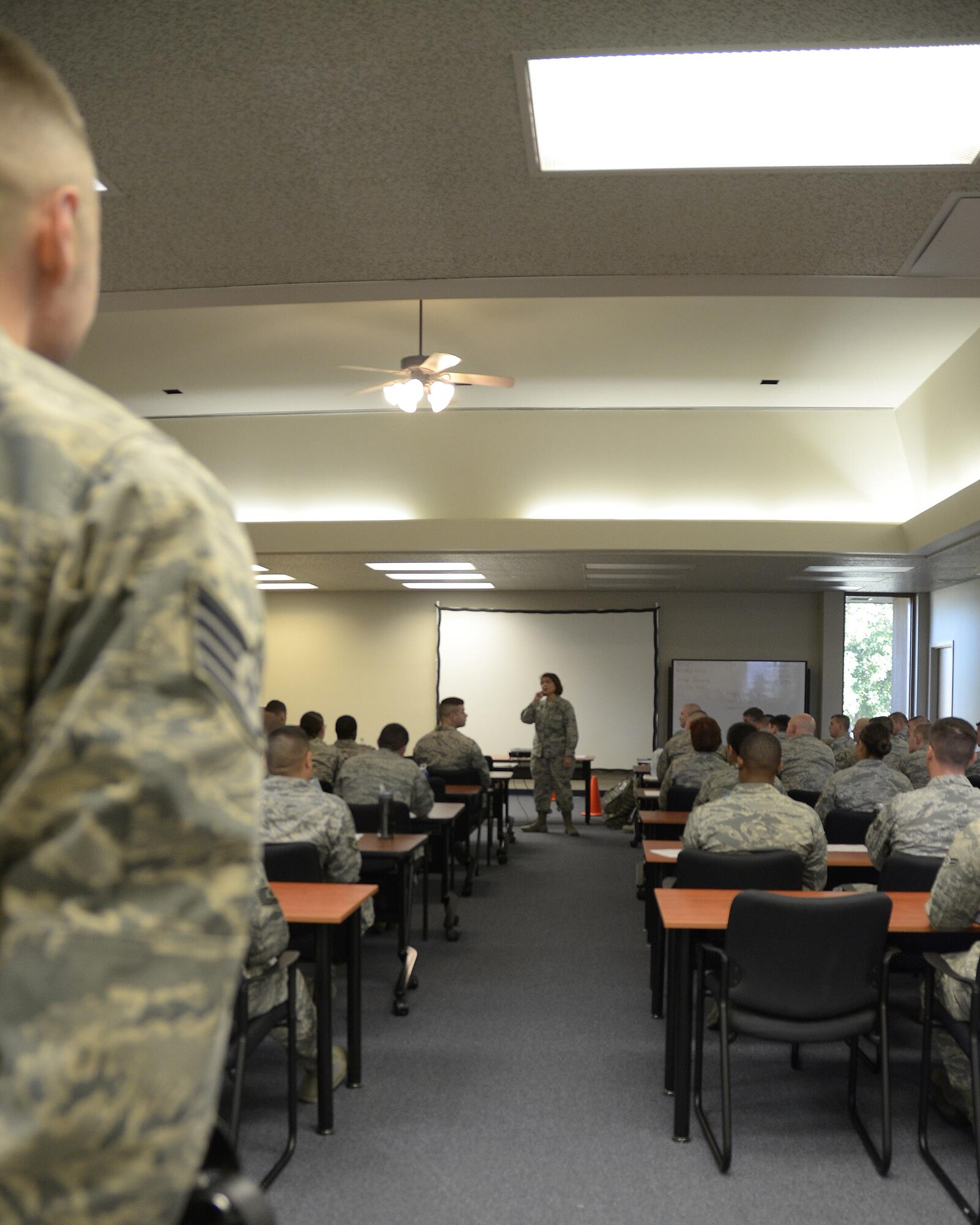Lt. Col. Kathy L. Merritt, commander of the 673rd Security Forces Squadron, Joint Base Elmendorf Richardson, Alaska, gives a welcome brief to Air Force Reserve defenders of the 445th Security Forces Squadron, Wright-Patterson Air Force Base, Ohio and the 720th Security Forces Squadron, Davis-Monthan Air Force Base, Arizona, July 19, 2016, at JBER, Alaska. The reservists are completing initial training so that they may assist the home SFS with guard duties and security at their July 30-31 air show. (U.S. Air Force photo/Senior Airman Joel McCullough)