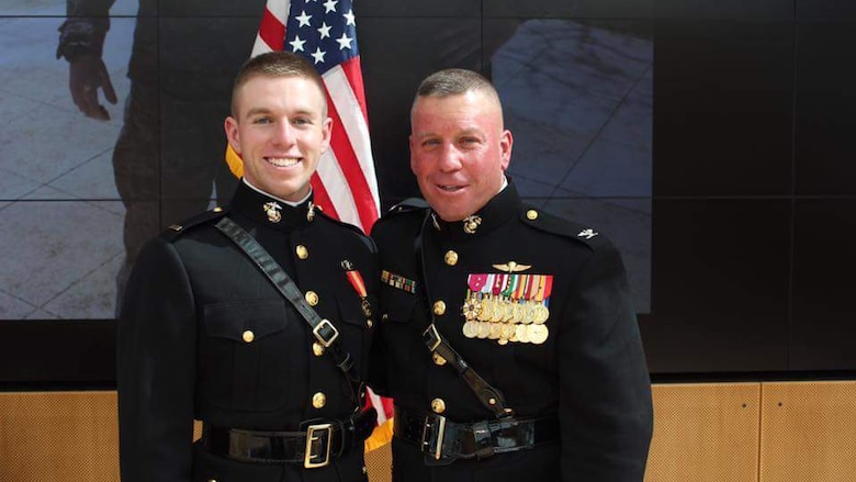 Second Lieutenant David Higgins, (left) poses for a photo with his father, Col. David A. Higgins at his commissioning ceremony on June 2, 2016. Lieutenant Higgins shoots rifle professionally, and will be representing not only Team USA, but also the United States Marine Corps in the 2016 Summer Olympics in Rio De Janeiro. Colonel Higgins is the G-3 Deputy of I Marine Expeditionary Force.