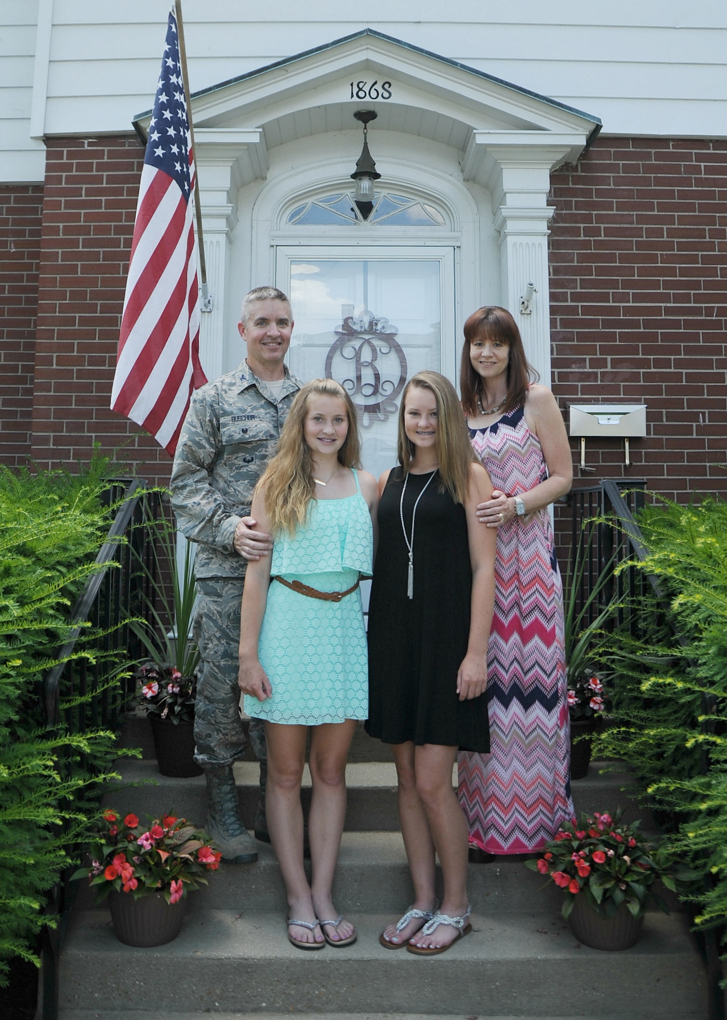 Col. Christ Buschur, the 375th Air Mobility Wing vice commander, with his family - wife, Sharon, and daughters, Lauren and Madison. (courtesy photo)