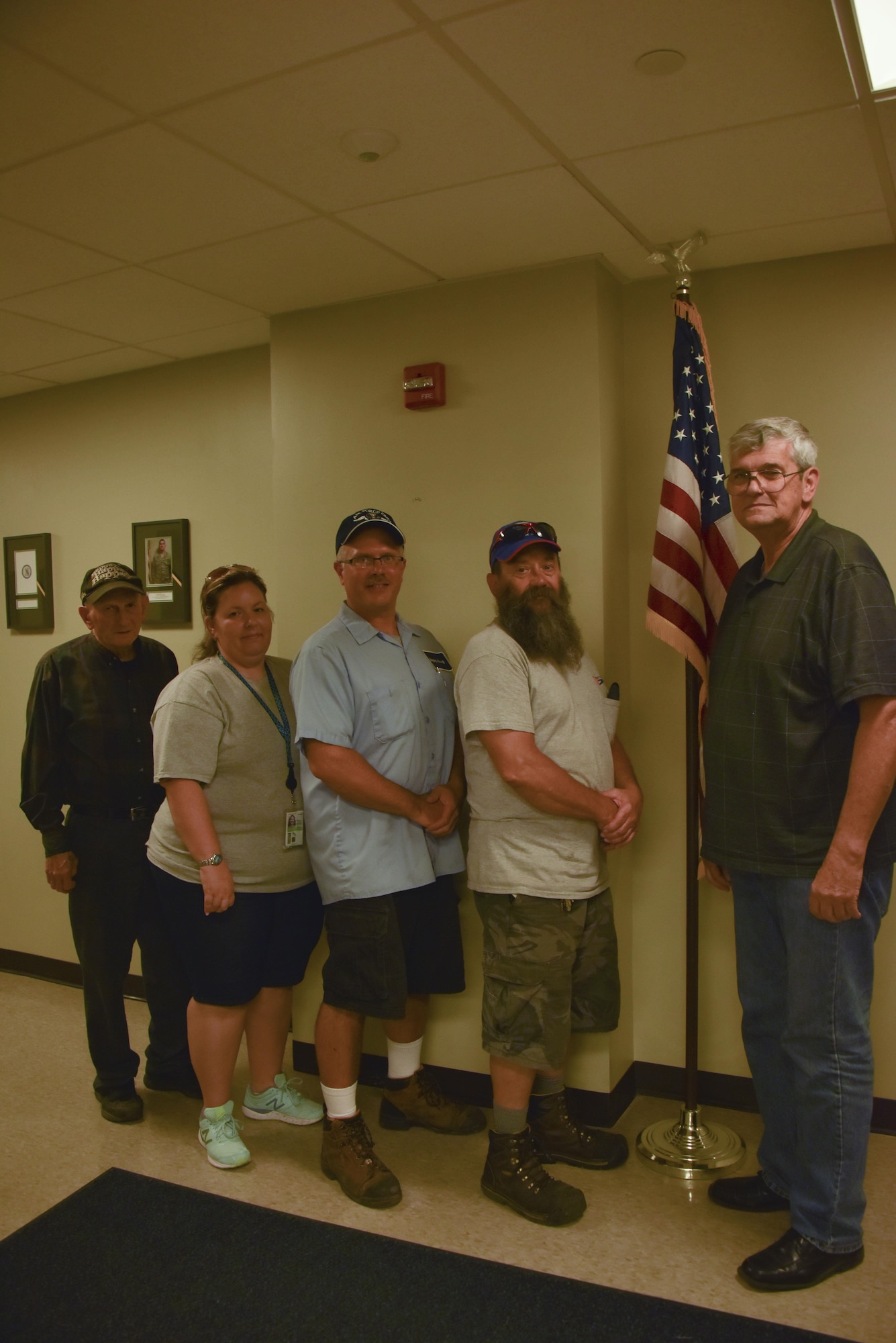 George Kelly, vehicle maintenance manager, stands with friends during his retirement party at the Pittsburgh International Air Reserve Station, Pennsylvania, July 26, 2016. Kelly’s future plans include relaxing and traveling the country. (U.S. Air Force courtesy photo by Ashley Podrasky)